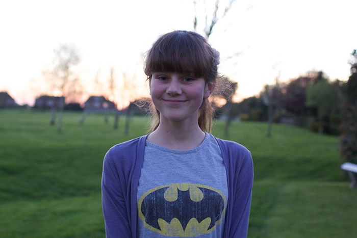 A cold portrait of a young girl posing outdoors