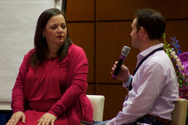 A guest and speaker conversing - Corporate Event Photography