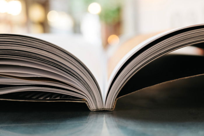 A close up of a photography book open on a table