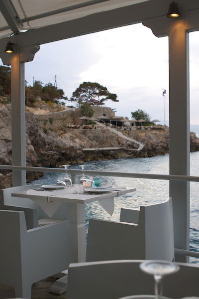 Photo of the sea coast taken from inside a cafe, demonstrating the use of vertical lines in photography composition