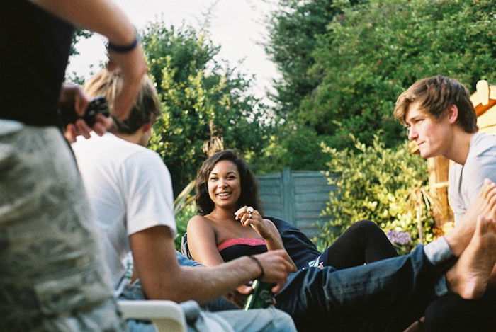 A candid photo of friends chilling at a garden party - when not to use a flash