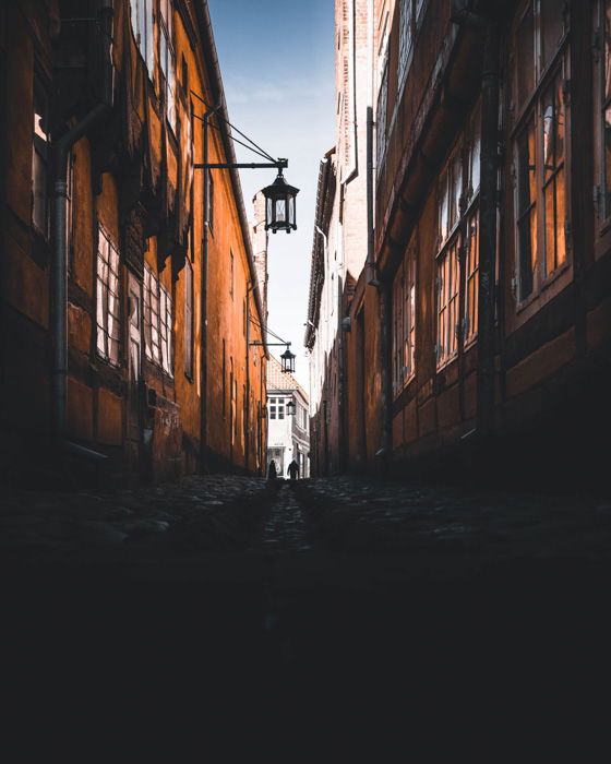 Low angle low light photography shot of a street alleyway