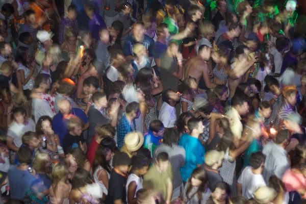 blurry photo of a crowd partying in a club