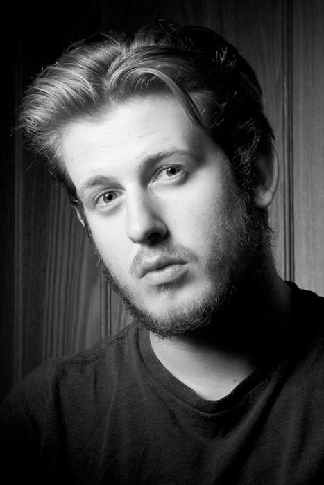 Black and white headshot photography of a young male model