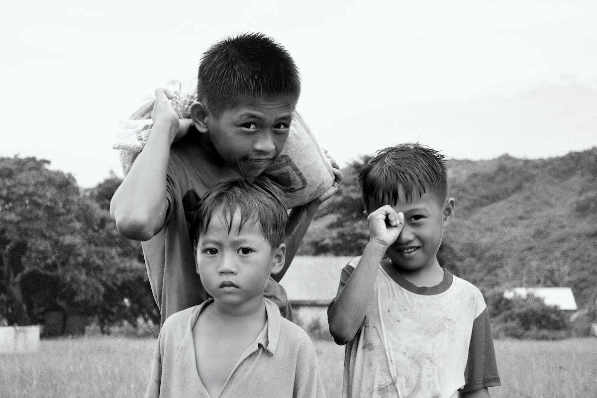 Portrait of three boys posing outside showing the principle of triangles in photography