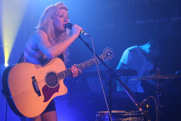 Blond female singer with a guitar