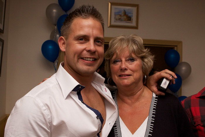 Cute portrait of two friends hugging at a party