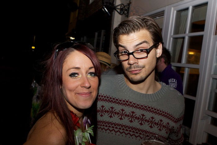 Cute portrait of two friends hugging at a party