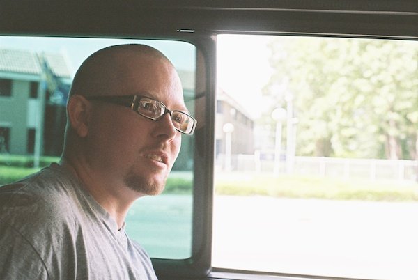 a man sitting inside a car - Window Light for Portraits