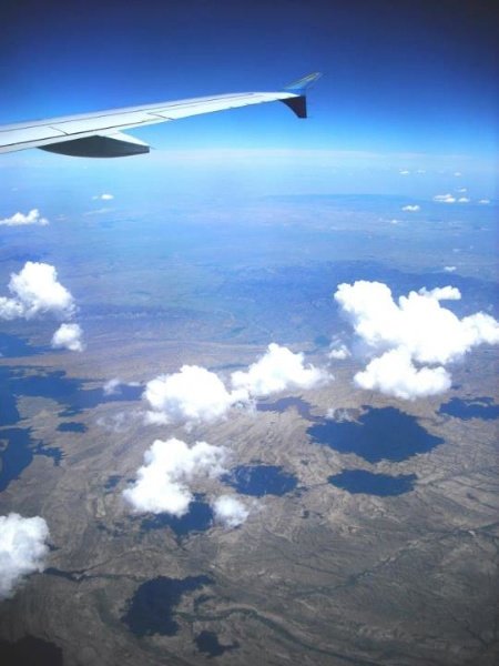 An image from a plane window overlooking plains. High Angle – 30 Day Photography Challenge Tips