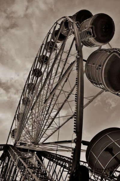 A sepia image of a Ferris wheel. Low Angle – 30 Day Photography Challenge Tips