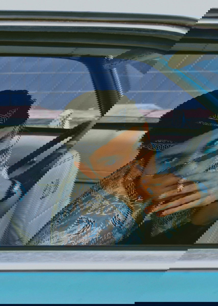 Portrait of a person smoking in a car