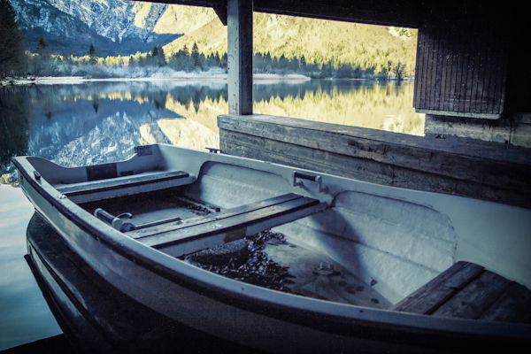 picture of a small boat with landscape in the background