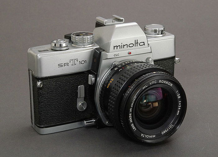 Minolta SRT-101 classic vintage camera on grey background