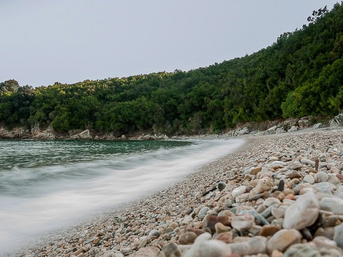 Waves breaking on the shore of Avlaki beach (Kerkyra, Greece), using motion blur in the waves