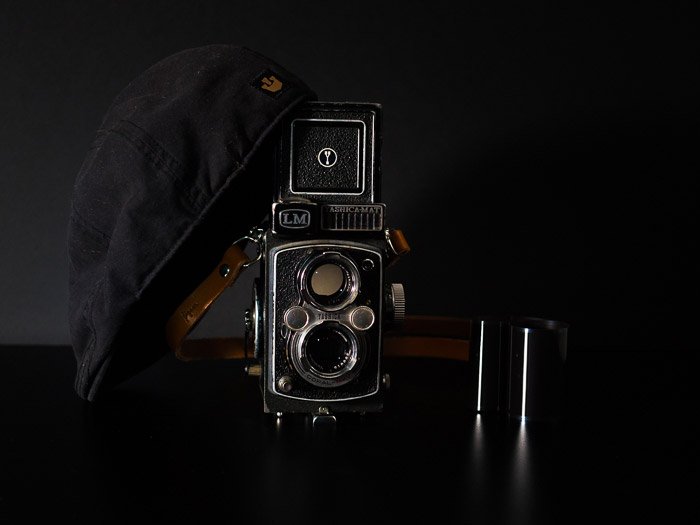 A Yashica-MAT LM TLR 6X6 medium format camera, on a black background