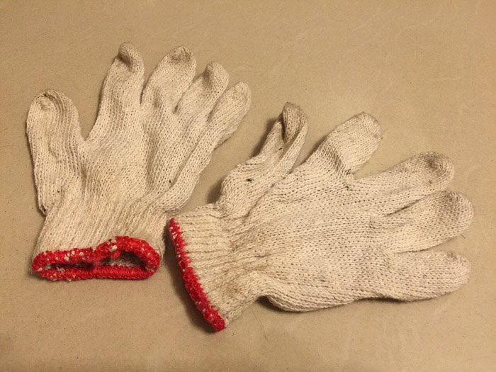 a pair of gloves on white background