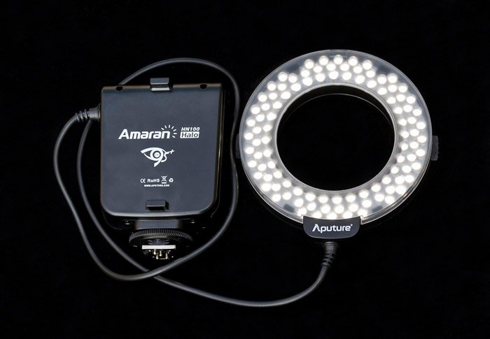 A ring flash unit for portrait lighting on black bacckground