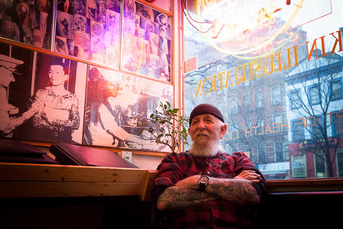 A candid portrait of a man sitting indoors