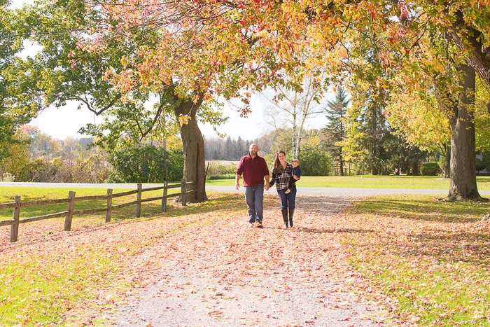 Family Portrait ideas of a couple walking casually through a scenic space
