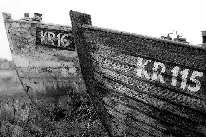 Black and white photo of weathered boats