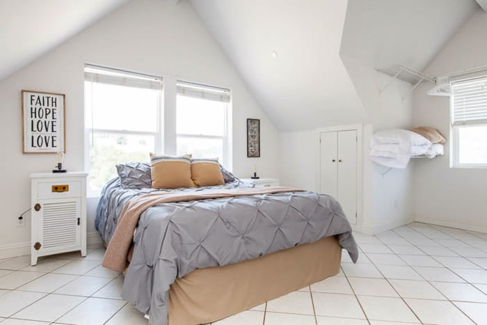 Bright and airy real estate photography of a bedroom with light balanced using bounce flash