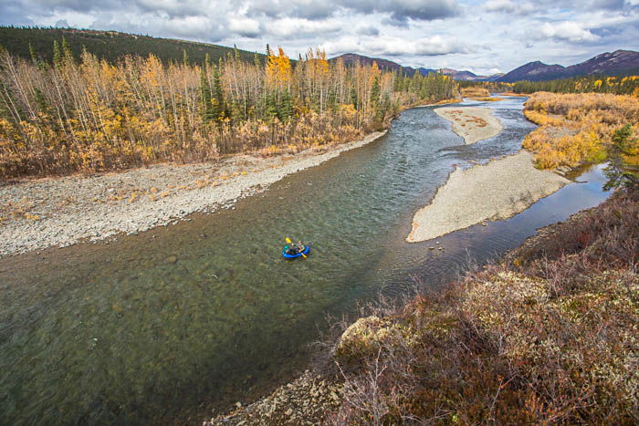 Adventure photography showing river rafting from a distance