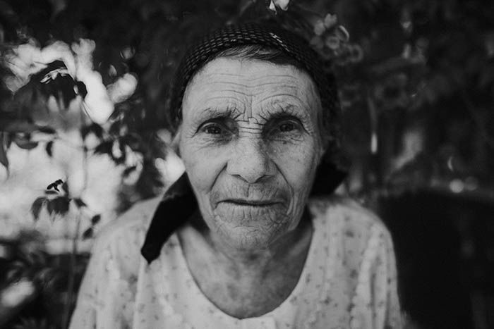 Black and white close-up of an old woman.