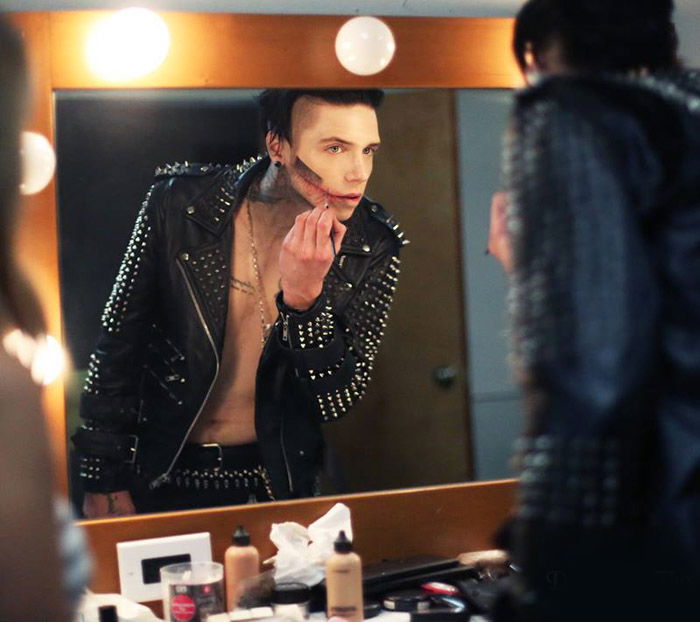 Performer preparing his makeup for a show. Backstage photography.