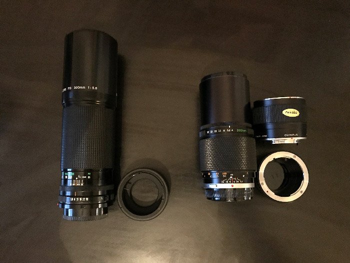 (left) Canon FD 300 f/5.6 with FD to M43 adaptor. (right) Olympus OM Zuiko 200 f/4 with its 2x teleconverter and OM to M43 adaptor.