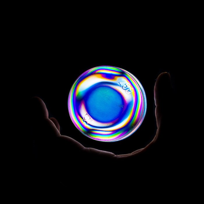 Homemade fantasy magic orb effect made with a plastic container and photoelasticity