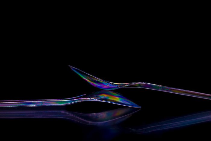 Plastic spoons highlighted with polarized light.