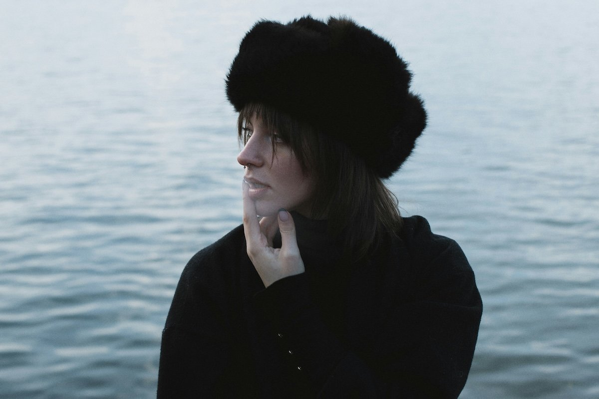 Woman in fur hat looking sideways as an example of eyeline photography