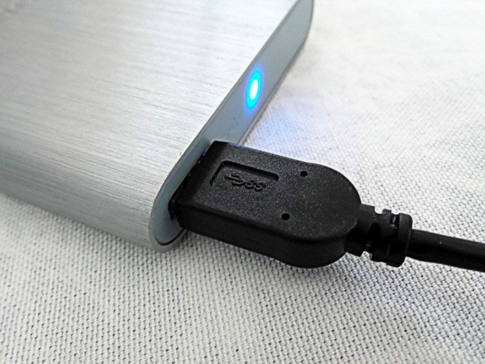 A USB cable plugged into a laptop