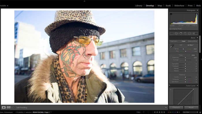 editing street photography - original photo of an old with a colorful face tattoo and eccentric clothes