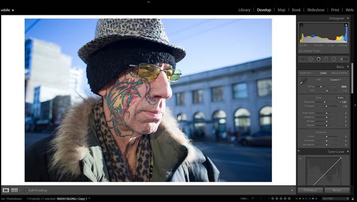 editing street photography exposure and contrast on a picture of an old man with a colorful face tattoo