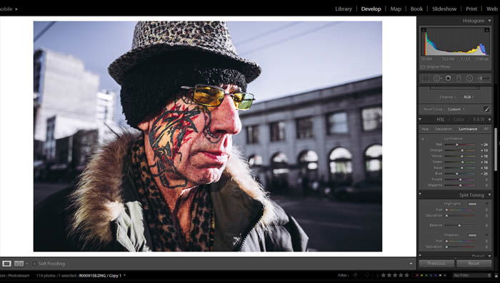 editing street photography - hue, saturation and luminance - picture of an old man with an interesting face tattoo and colorful glasses