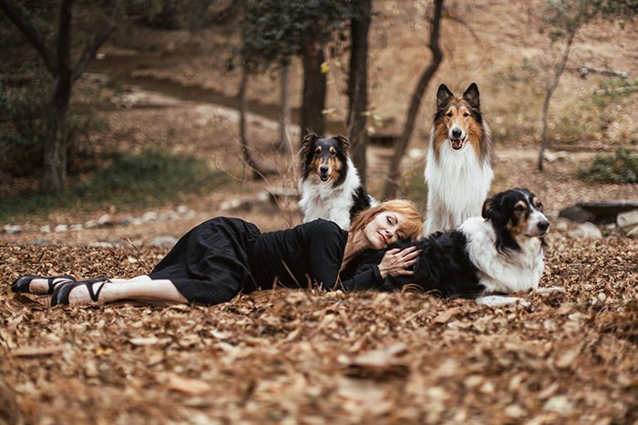photo of a woman and her dogs