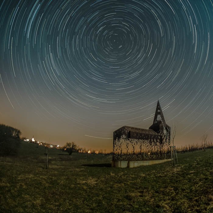 Star trails over the See-through Church in Borgloon, Belgium