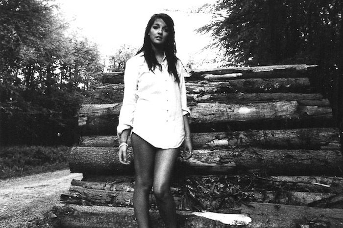 Atmospheric portrait of a female model shot with black and white film