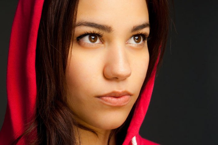 Close up of a female model in a red hoodie