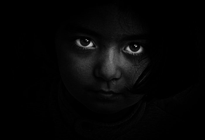 Striking black and white photos of a girl, focused on the eyes
