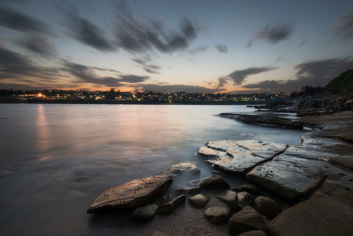 long exposure sunset over a coastal town