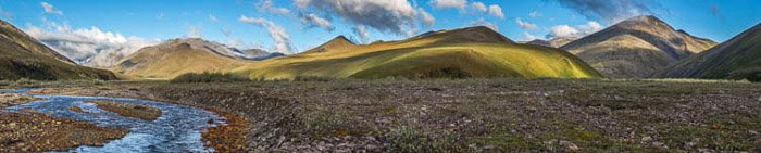 A panoramic photo of the lucious landscape at Aichilik River in Alaska