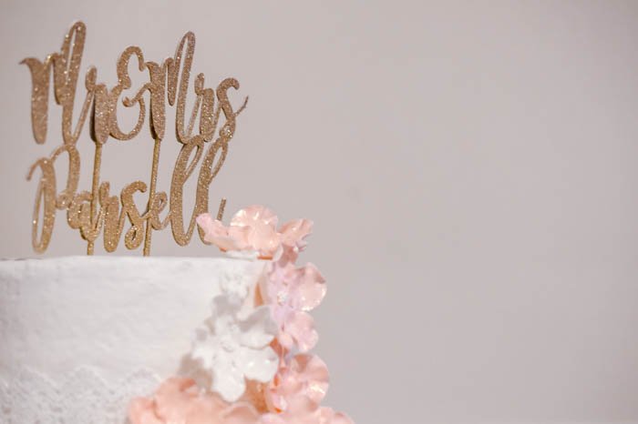 A close up of a Wedding Cake against a light background