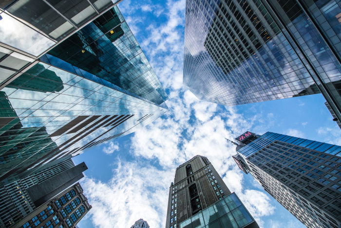 Looking up at huge skyscrapers