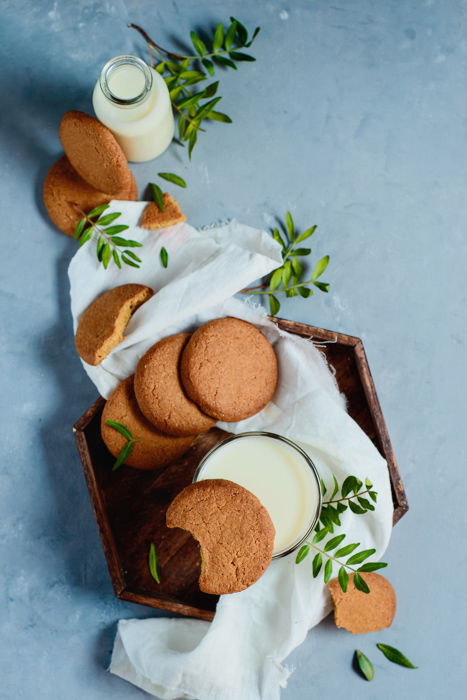 Biscuits, milk, and decorative leaves. 