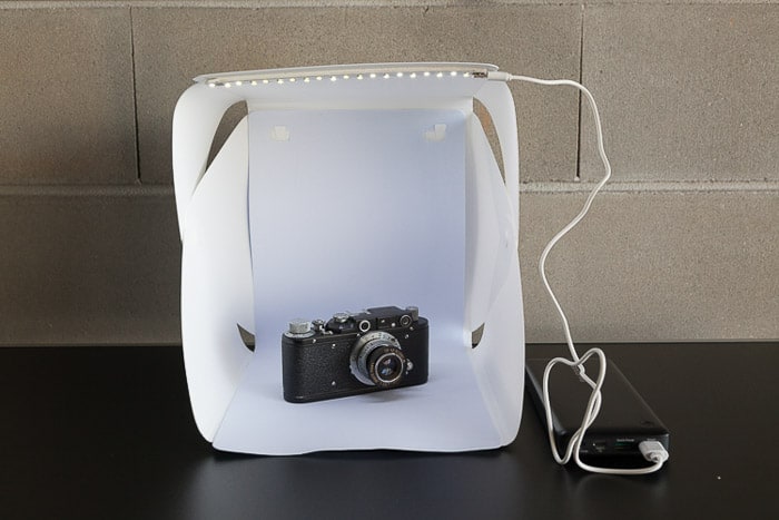 A photoshoot setup containing a camera in a diy light box