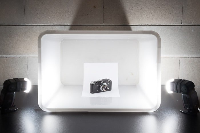 A diy photoshoot setup containing a camera in a White Box Flash Diffuser