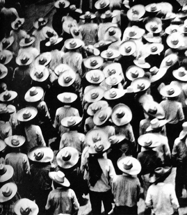 Overhead photo of a crowded street by Tina Modotti